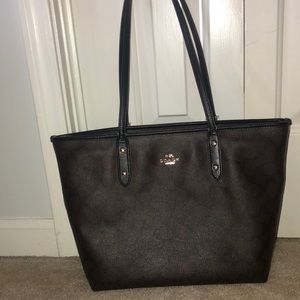Coach Purse. Slight use. Black Brown classic pattern.